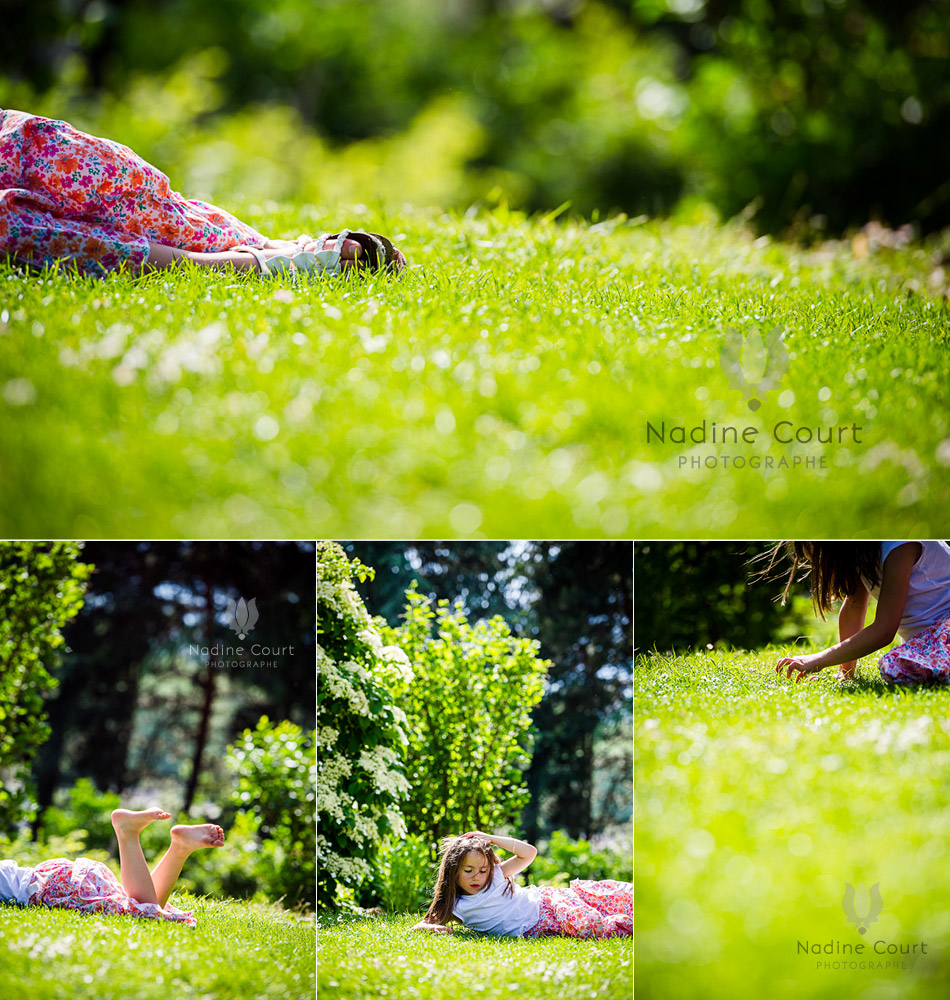 Fillette-jouant-dans-gazon-vert-tendre Petite fille allongée dans l'herbe verte
