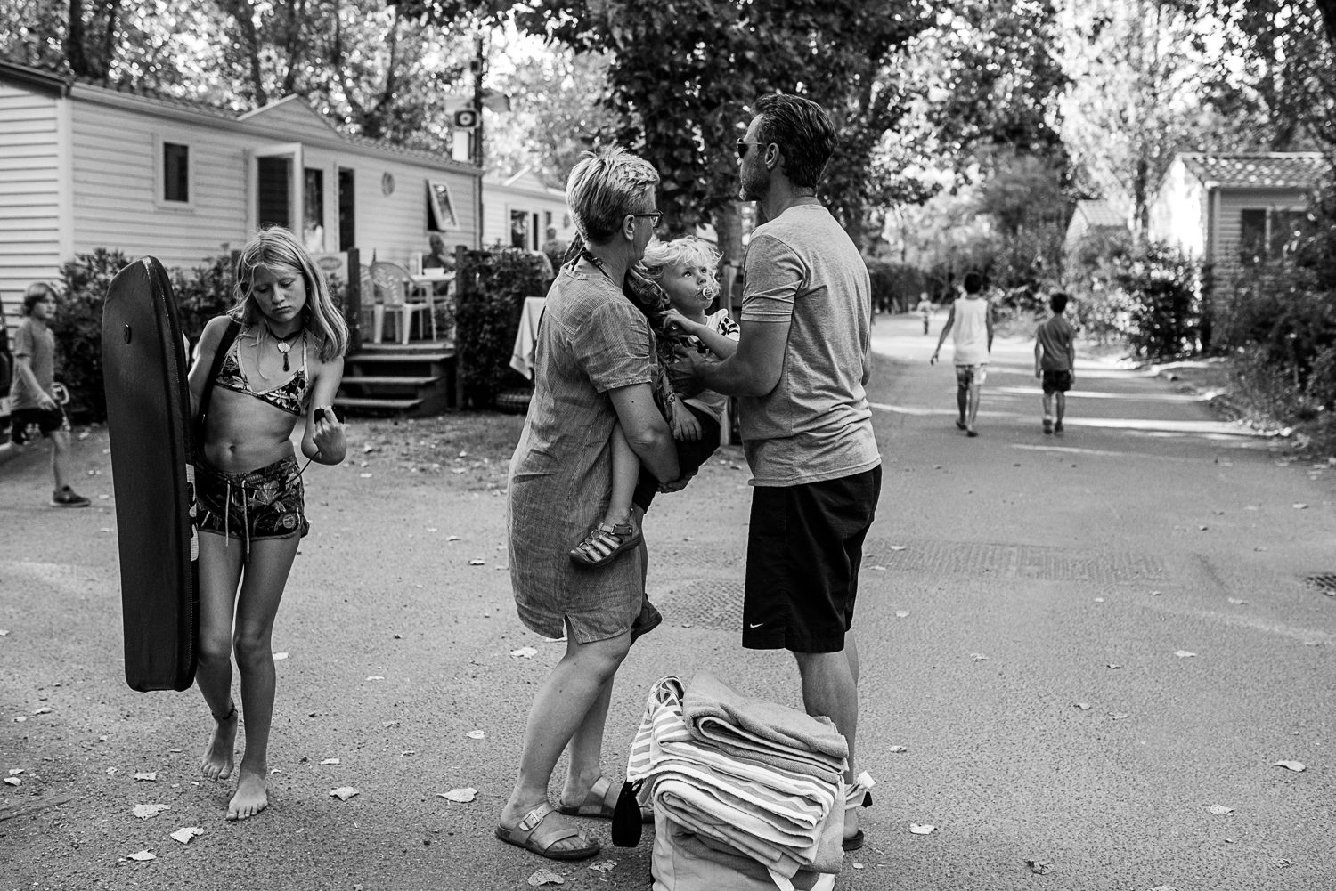 Family holidays in France - Day in the life session - family photojournalism - Camping family life in Beziers France - playing petanque