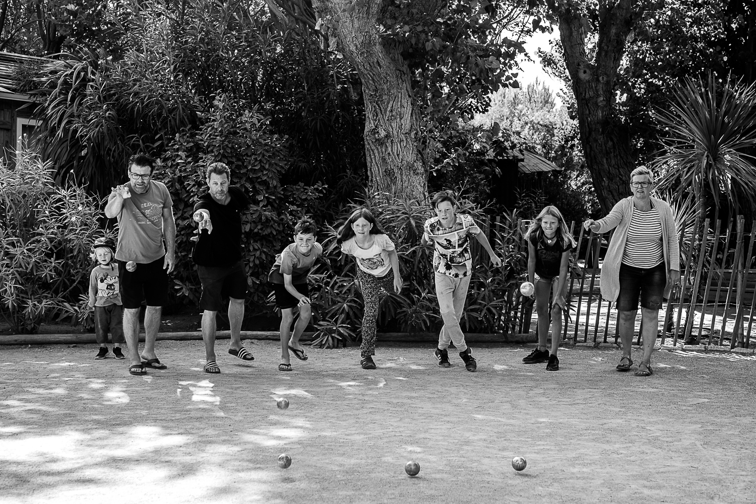 Family holidays in France - Day in the life session - family photojournalism - Camping family life in Beziers France - playing petanque