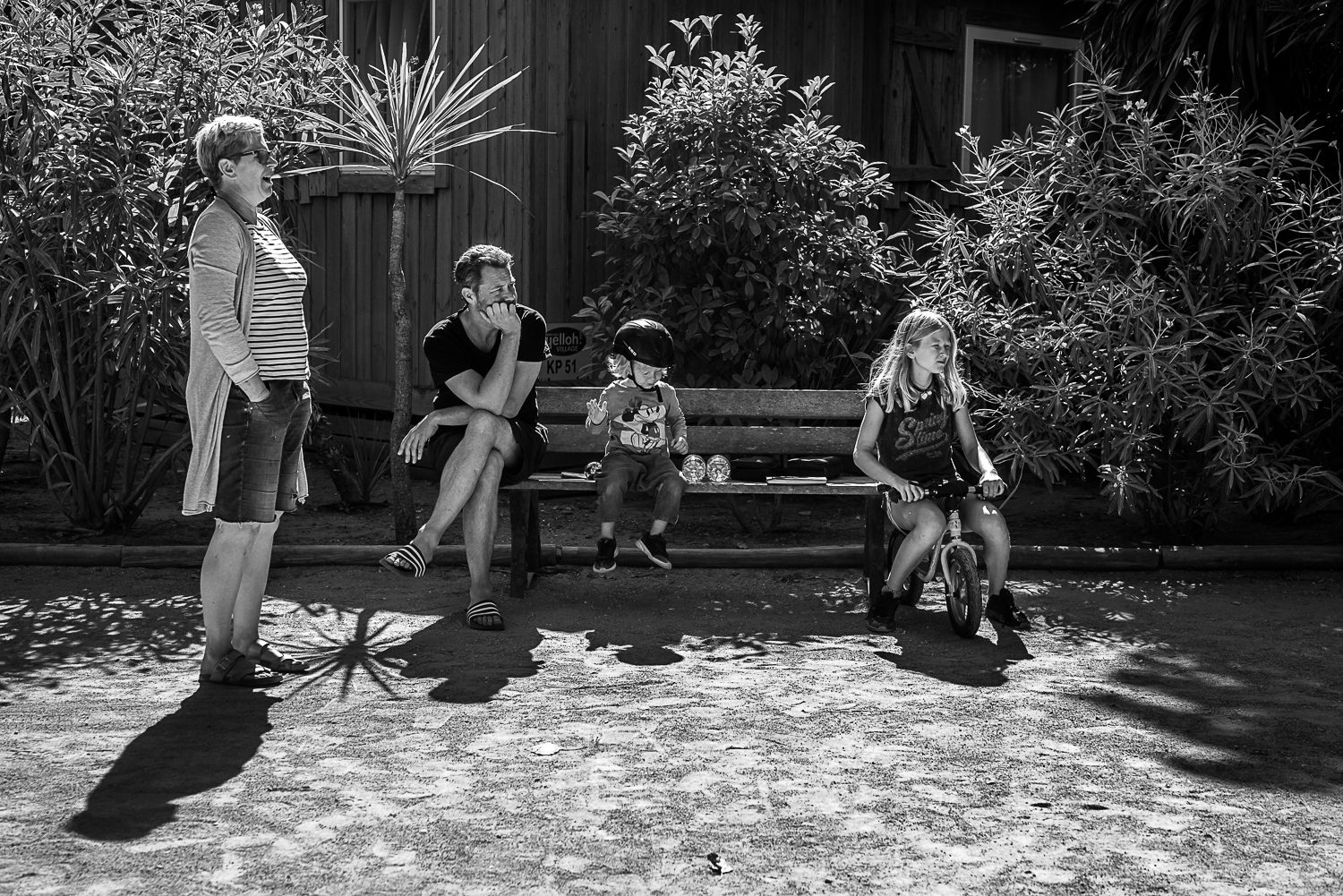Family holidays in France - Day in the life session - family photojournalism - Camping family life in Beziers France - playing petanque