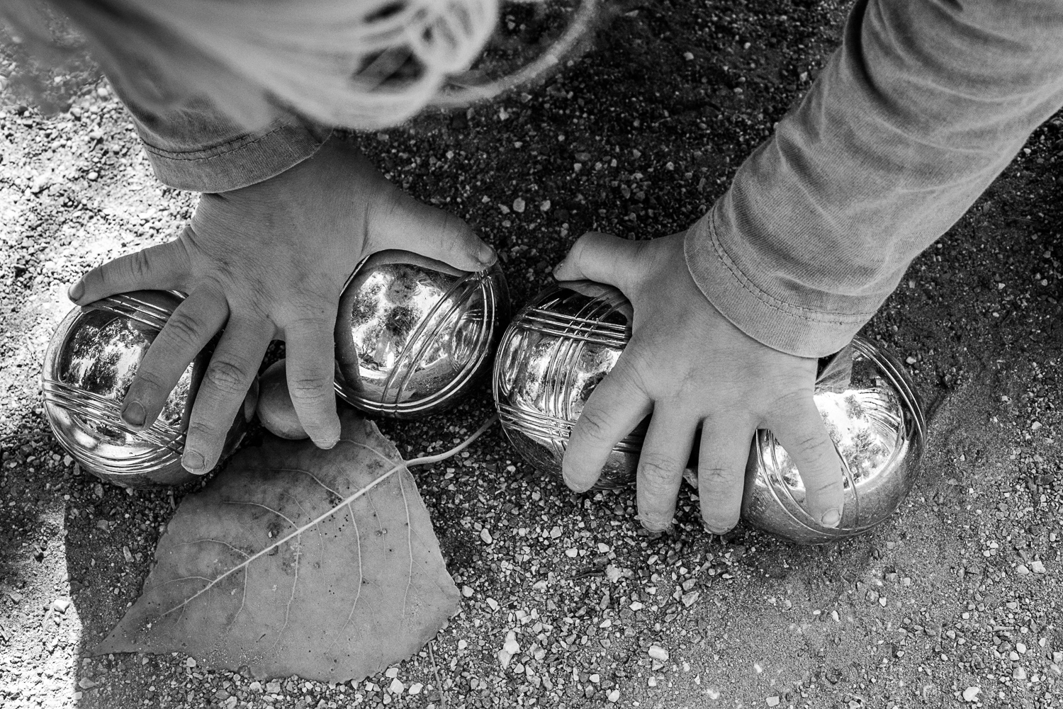 Family holidays in France - Day in the life session - family photojournalism - Camping family life in Beziers France - playing petanque