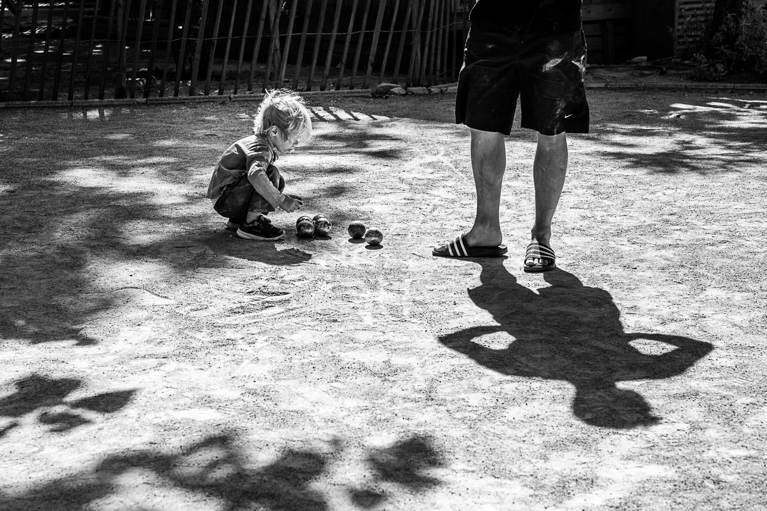 Family holidays in France - Day in the life session - family photojournalism - Camping family life in Beziers France - playing petanque